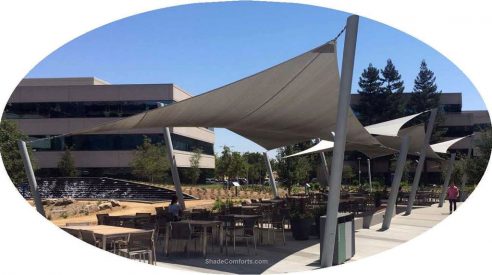 This tensioned fabric shade structure is a tensile structure with hypar shade sails.  It permanently covers a commercial courtyard in California.