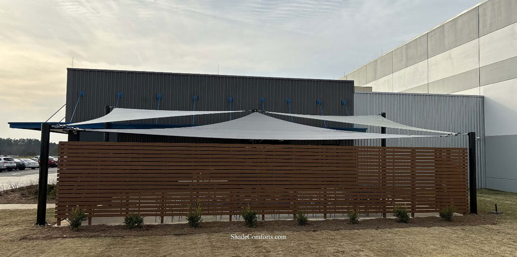 Shade sail triangles cover corporate patio in Georgia.